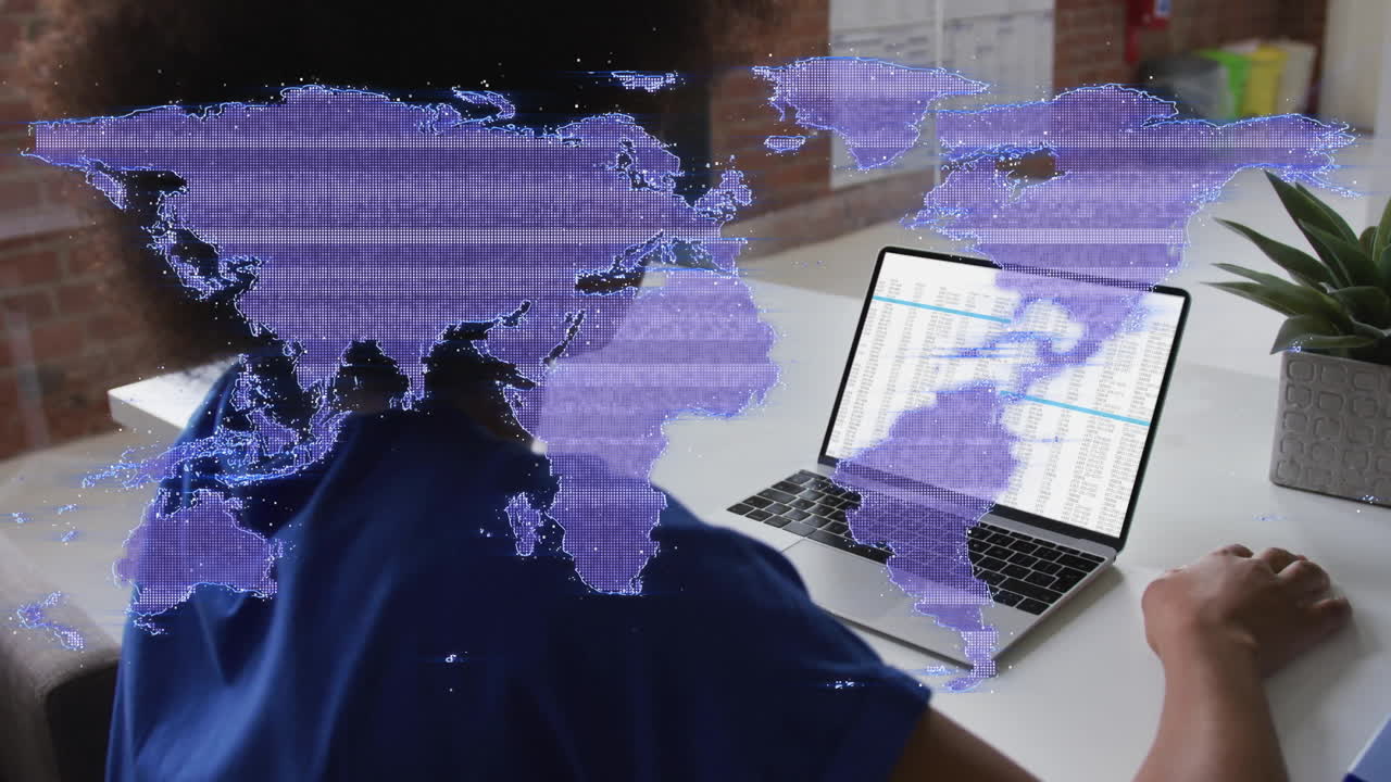 World map animation over person working on laptop with data spreadsheets