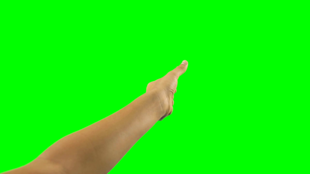 persona haciendo un gesto de la mano contra el fondo de la pantalla verde
