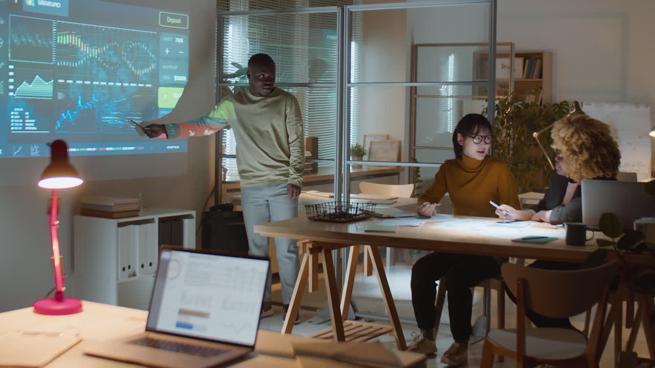 Multiethnic Team Having Business Meeting Late at Night