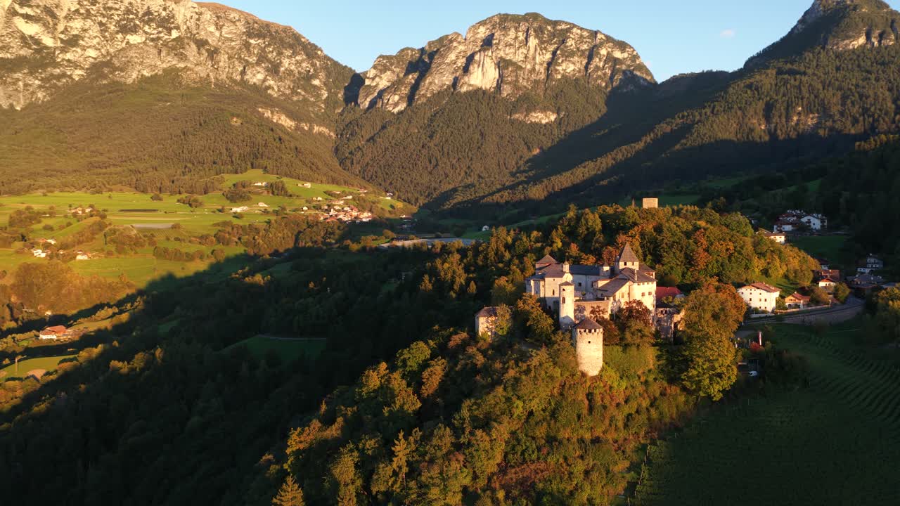 Prosels Castle, gothic style castle on high plain at the Schlern mountain in south tyrol Italy. Aerial video