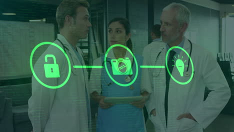 Animation-of-flowchart-of-icons-over-diverse-doctors-standing-and-discussing-in-hospital