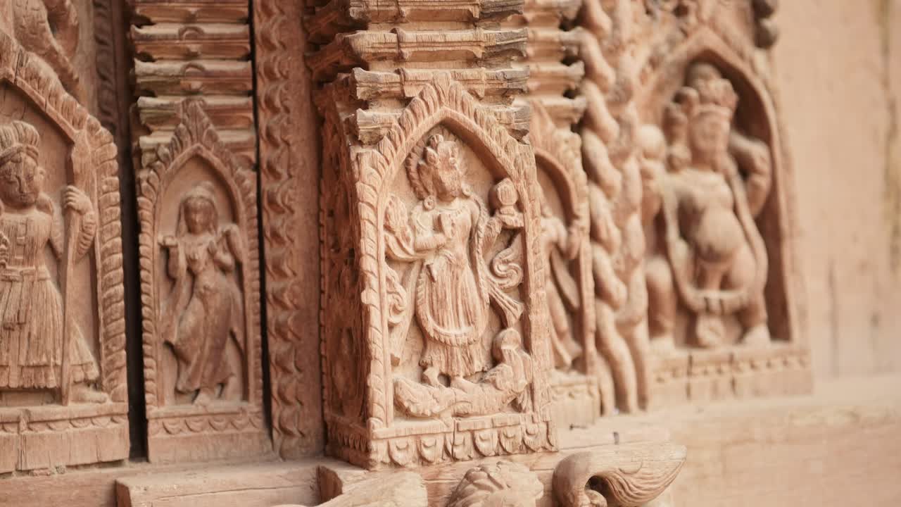 Intricate Wood Carving in Kathmandu, Carved Wooden Architectural Details in Amazing Elaborate Figures Carved into Wood in the Door of a Temple in Durbar Square in Nepal