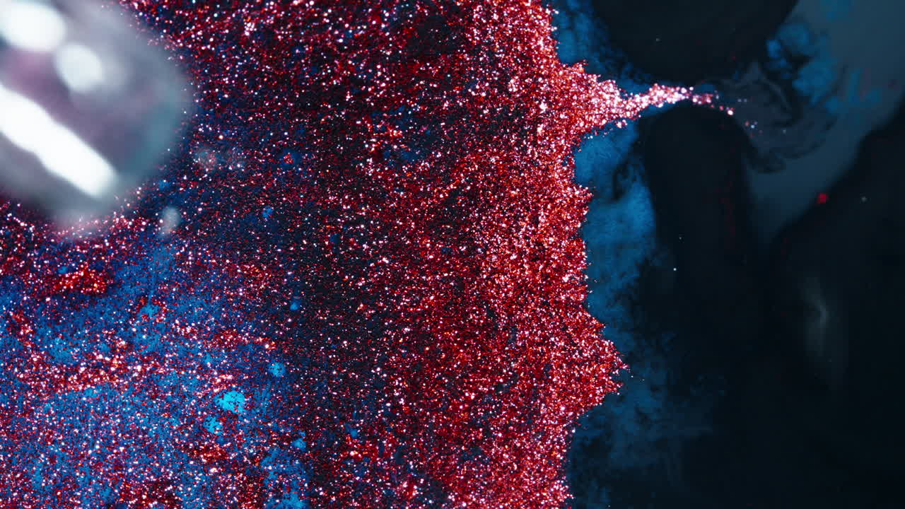 Colorful ink swirling in water, creating abstract patterns