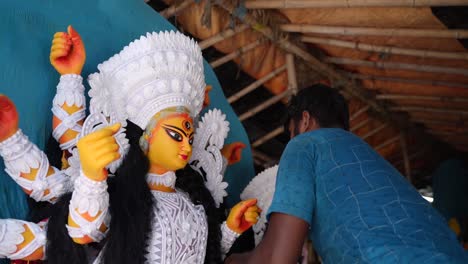 in kumortuli, idol artists are making idols of durga, the revered deity of hinduism. the work of making these idols starts from june and these potters make many idols till november.