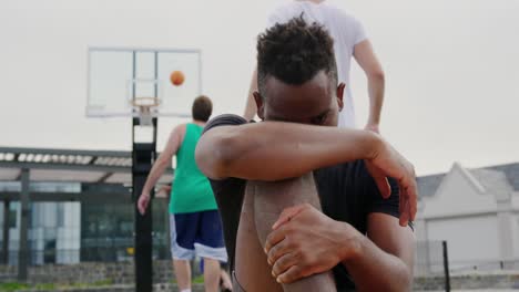 basketball player sitting in basketball court 4k