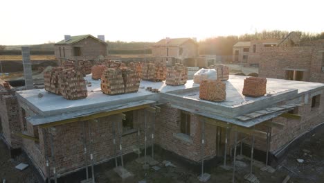 aerial view of residential houses under construction in rural suburban area. real estate development