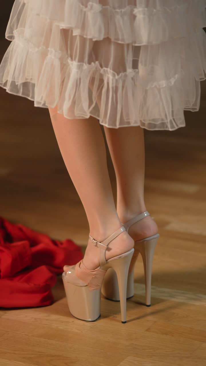 Woman in white dress and high heels