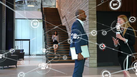 animation of network of connections with icons over business colleagues