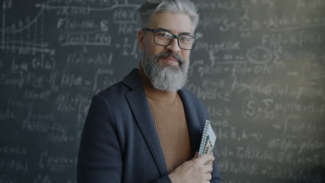 teacher in front of chalkboard