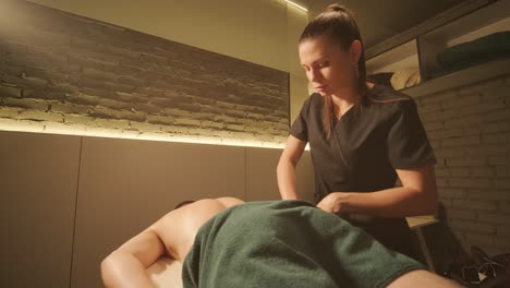 professional massage therapist performing relaxation massage