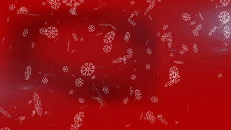 animación de copos de nieve cayendo sobre un fondo rojo