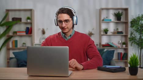 young man in online video conference on laptop