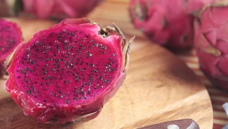 sliced dragon fruit on wooden cutting board