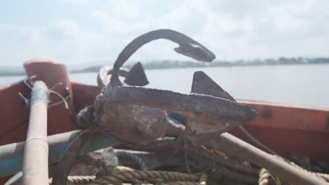 close up rusty anchor on a small indian fishing boat