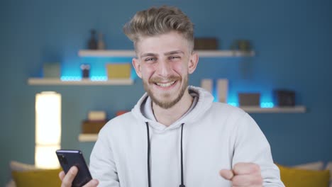 Portrait-of-young-man-rejoicing-at-the-good-news.