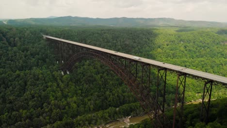 Parallax-drone-shot-of-New-River-Gorge-Bridge-in-Fayetteville,-WV