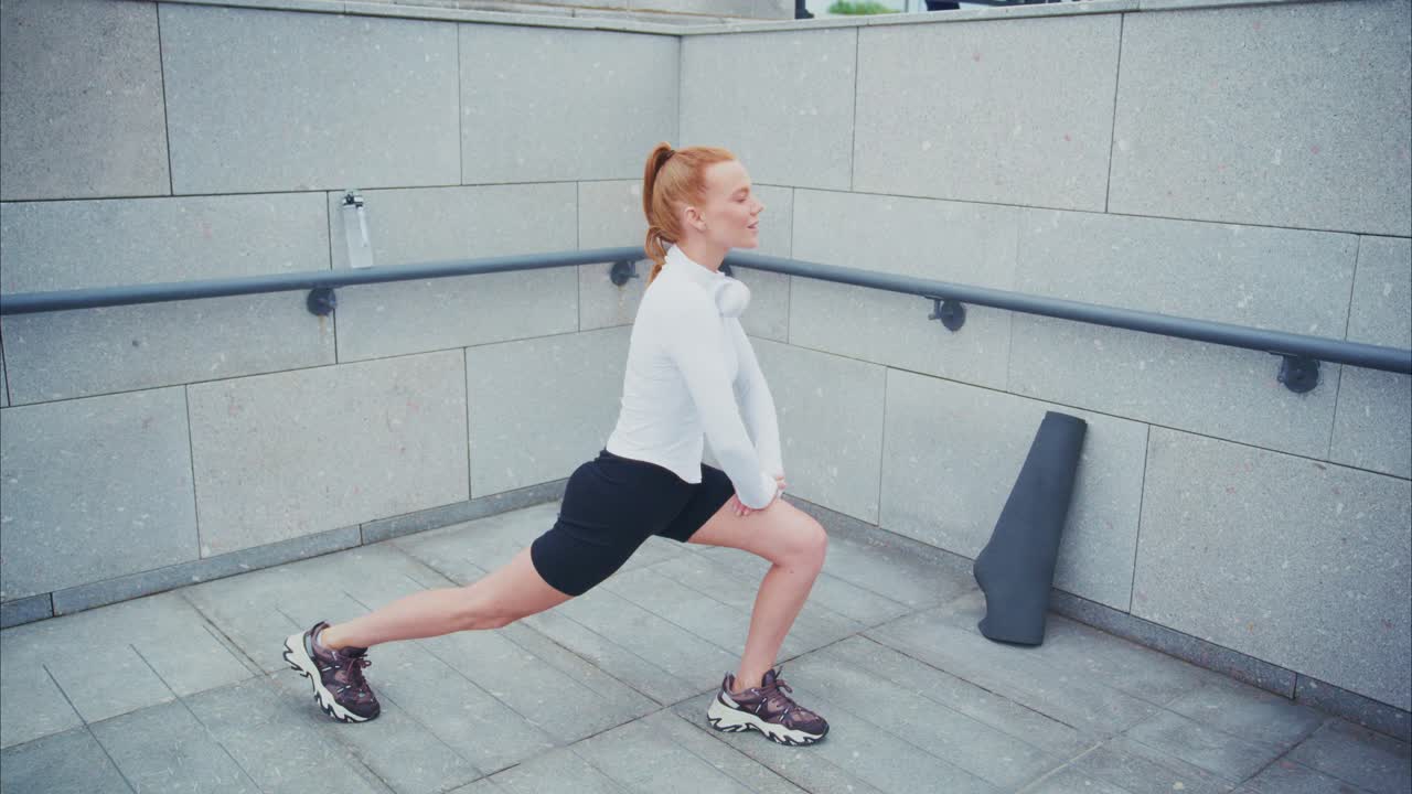 A woman stretching outdoors