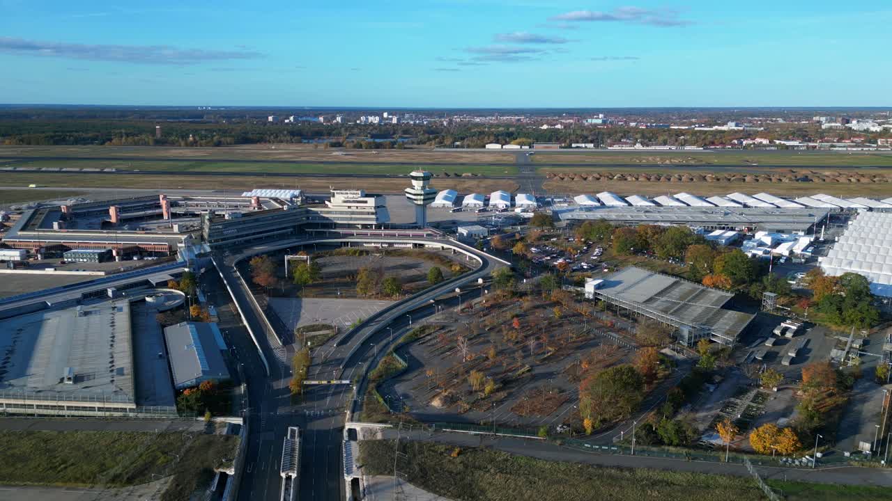 berlin tegel airport showing the main terminal, control tower, hangars. Now Refugee home. Fabulous aerial view flight drone shot footage from above