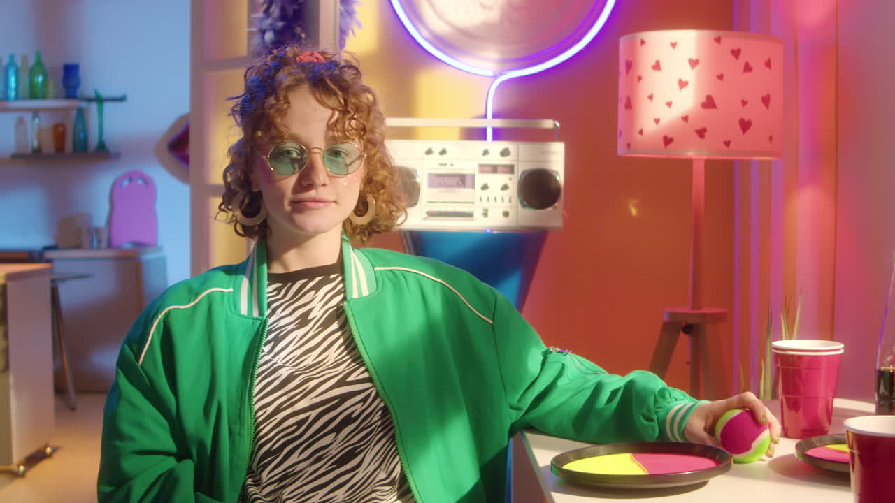 Teenage girl in 80s/90s fashion at a party