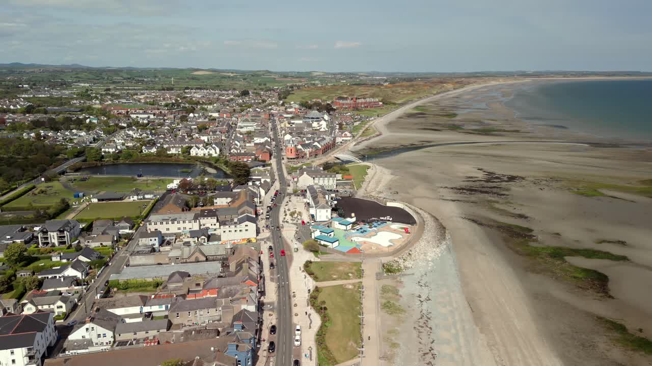 Aerial video of Newcastle Beach and Main Street in Newcastle, County Down in Northern Ireland in the UK. Filmed on a bright sunny day in 4K, 60fps and in Rec709 Color.