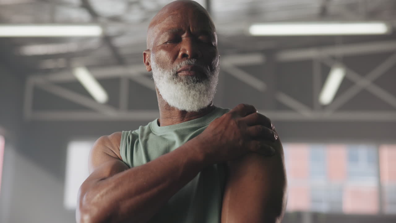 Senior man with shoulder pain after workout