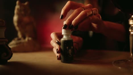 woman putting tip back into pipette glass filled with poison