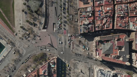 Birds-eye-view-of-intersection-at-El-Cap-de-Barcelona-statue.-Blocks-of-houses-in-urban-borough.-Barcelona,-Spain