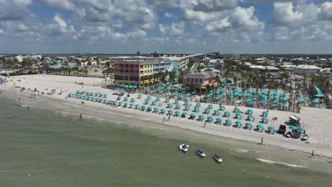 Drone-view-of-busy-Ft.-Myers-Beach,-Florida