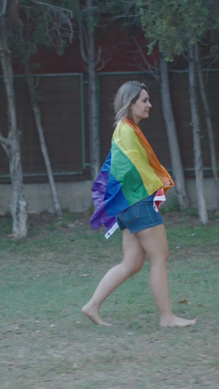 Woman Walking with Pride Flag
