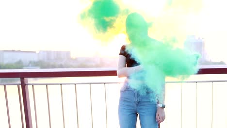 woman makes emergency flare signal. hipster girl with smoke bomb