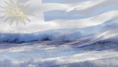 digital composition of waving uruguay flag against waves in the sea