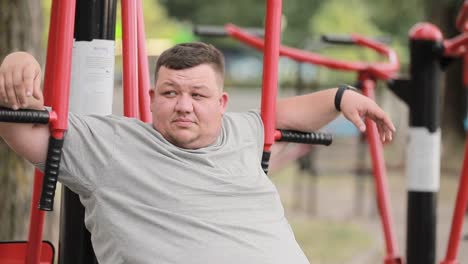 tired fat overweight man resting after doing sports in the park fat people and sports tired fat overweight man resting after doing sports in the park fat people and sports