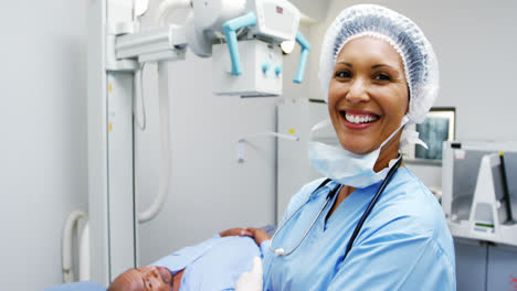 Portrait-of-female-surgeon-standing-with-arms-crossed