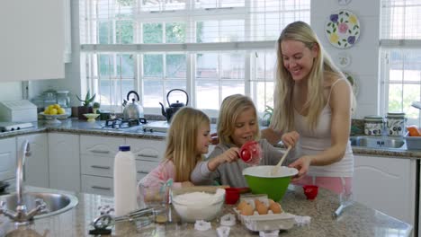 family making christmas cookies at home