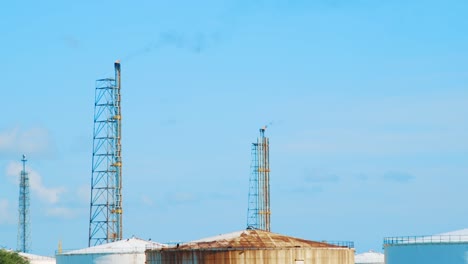 Smoke-billowing-from-smokestacks-at-oil-refinery-in-Willemstad,-Curacao