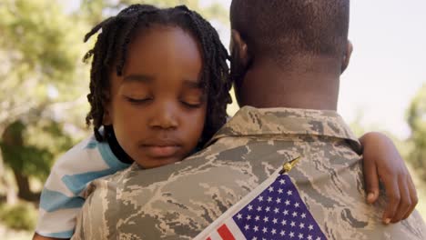 American-soldier-is-hugging-his-son-