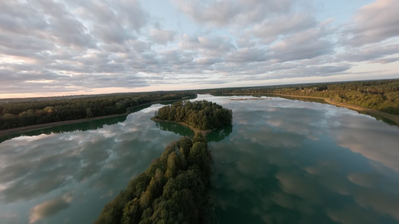 Sawinda lake in Masurian lake district Poland nature landscape FPV view