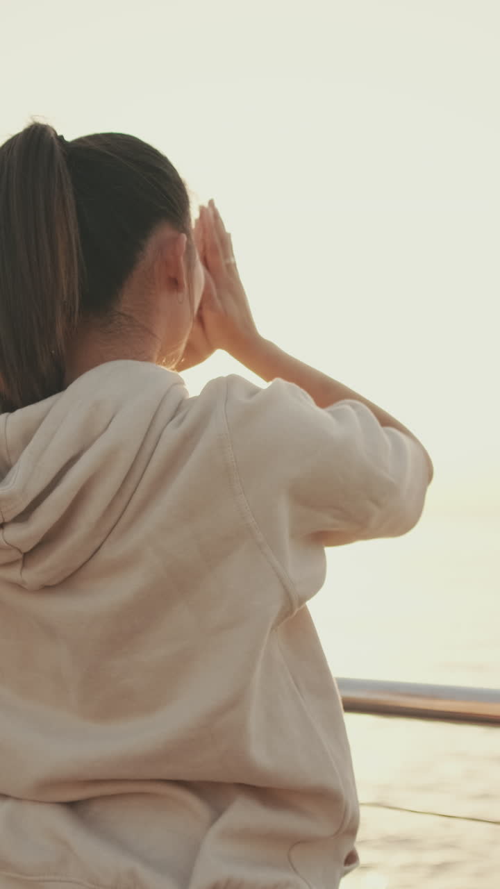 Woman with Ponytail in Hoodie at Sunrise