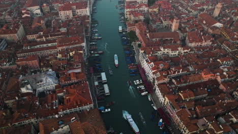 aerial view over grand canal and cityscape in venice, italy - drone shot