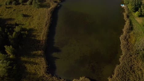 aerial tilt shot revealing the kastelholma castle, golden hour in aland, finland