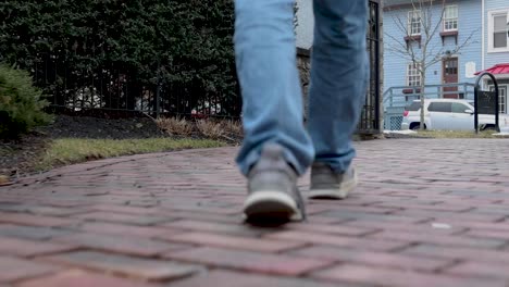 slow motion shot of feet waling down a path