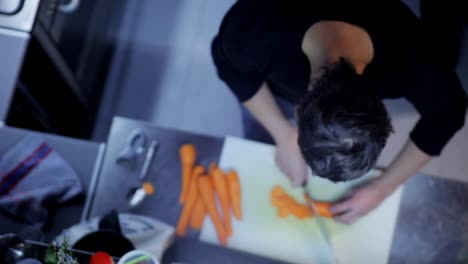 Man-Preparing-Food-in-Kitchen-00