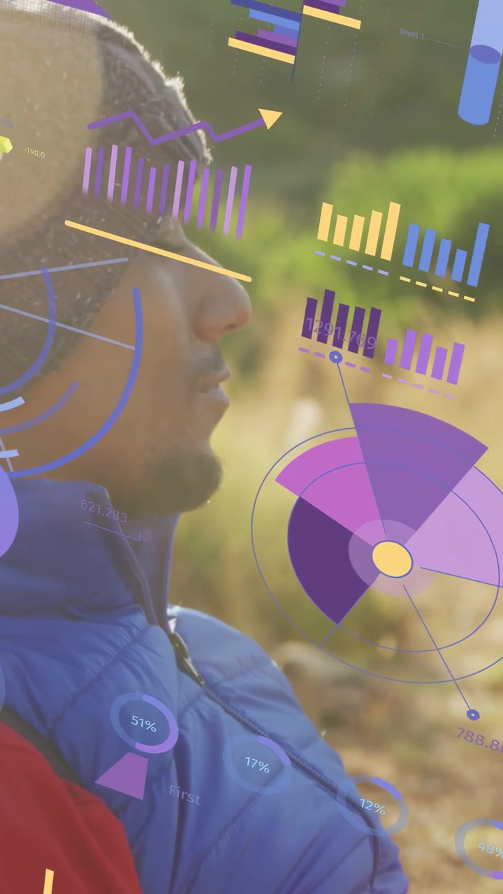 Vertical video: Man raising gaze in field, tech HUD sweeping in drawing focus to data charts