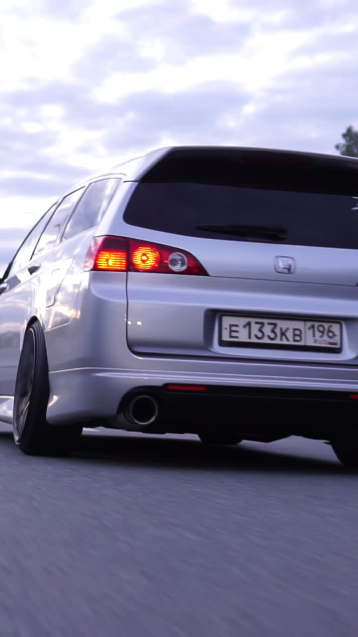 Silver Honda Sedan on the Road