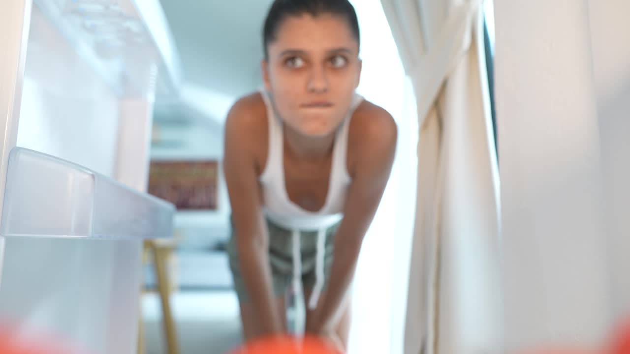 Woman Opening Refrigerator
