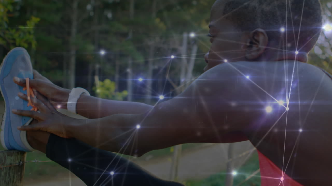 Animation of network of connections over woman stretching exercising in forest