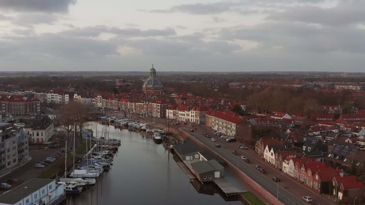 Aerial shot of the historical harbour and quay in Middelburg, during sunset