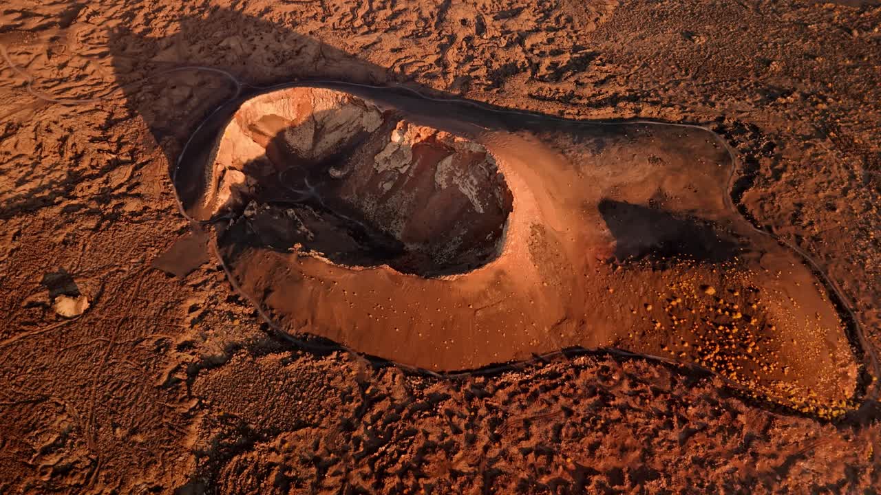 Breathtaking aerial drone footage of Volcano del Cuervo at sunset in Lanzarote, Canary Islands, Spain.
