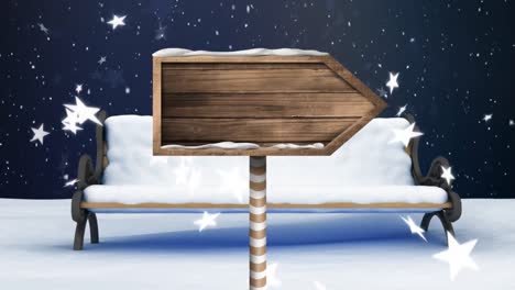 snow falling and wooden sign board