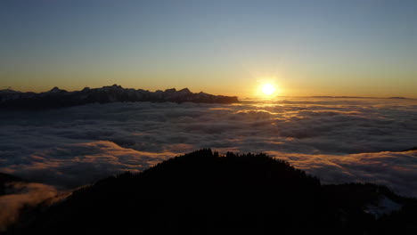 thick fog over lac leman and le folly summit in foreground in the prealps over montreux, vaud switzerland